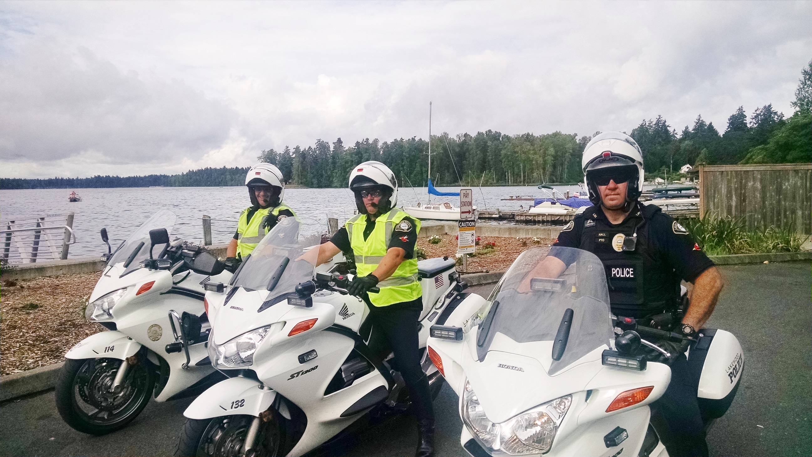 Three traffic officers on motorcycles. 