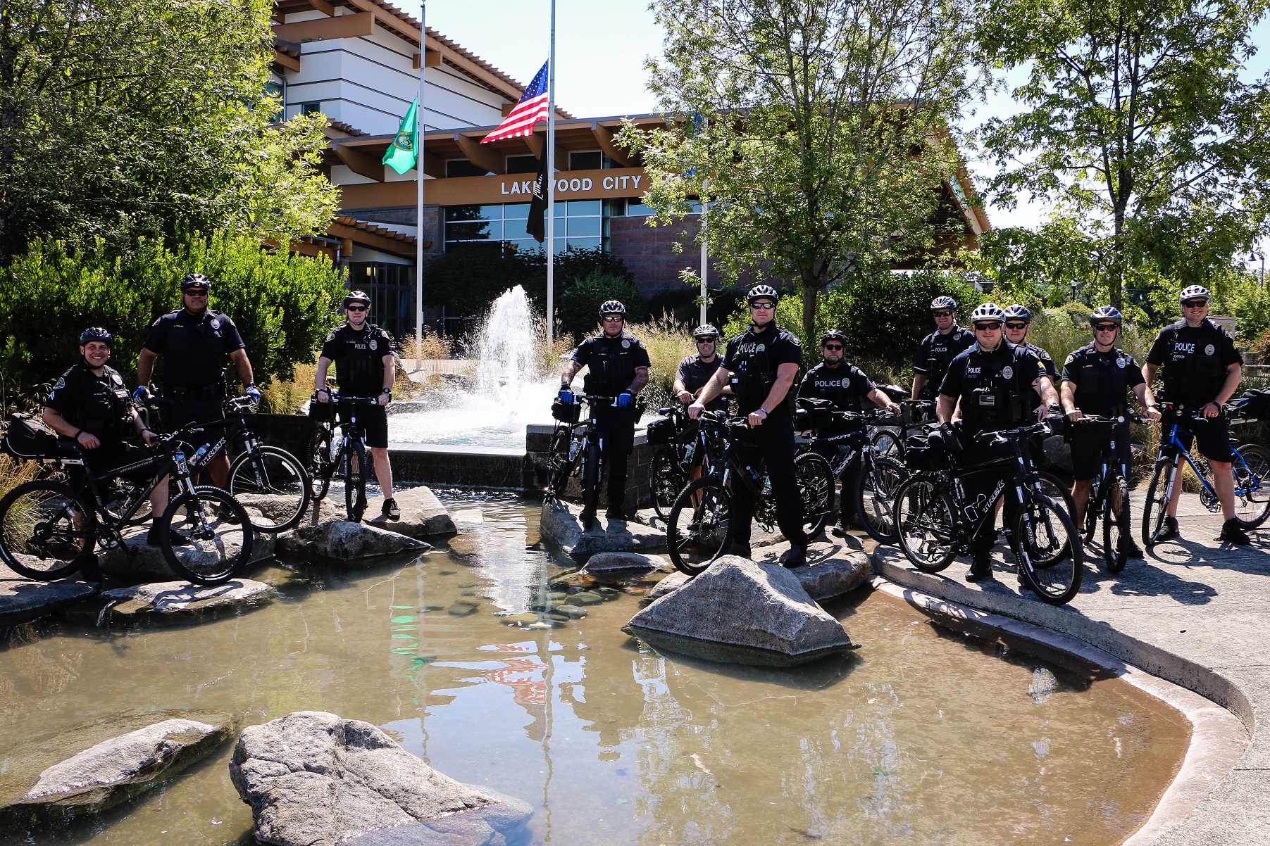 Lakewood Police Bicycle Officers pose for a photo in front of Lakewood City Hall.