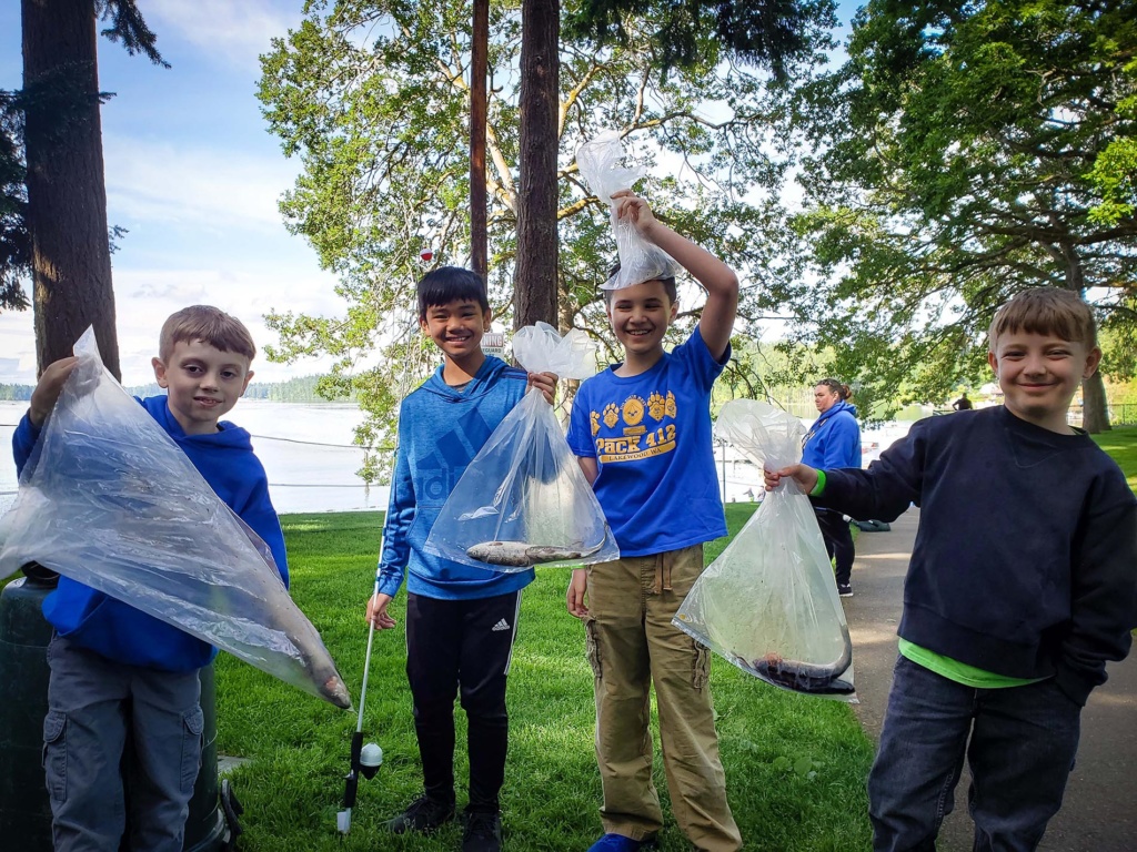 Kids holding the fish they caught at the Lakewood 2019 Ray Evans Memorial Fishing event