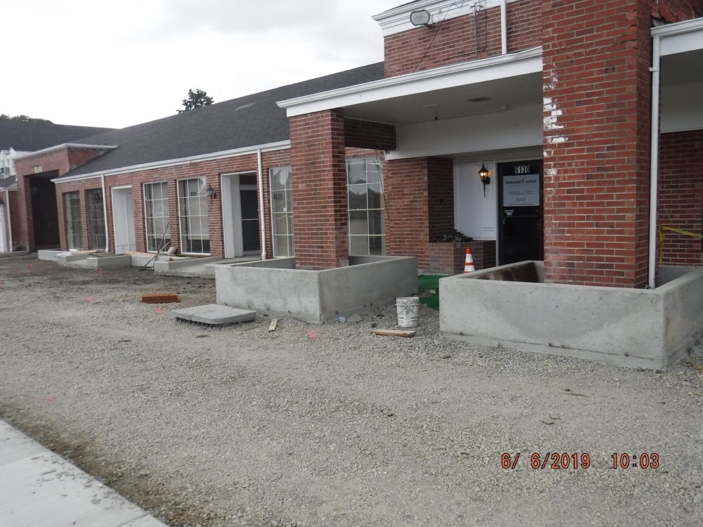 Picture showcasing the concrete curbs and work completed to date on the Colonial Center Plaza project.