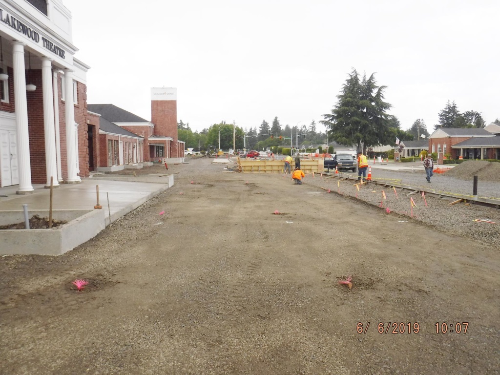 Picture showcasing the concrete curbs and work completed to date on the Colonial Center Plaza project.