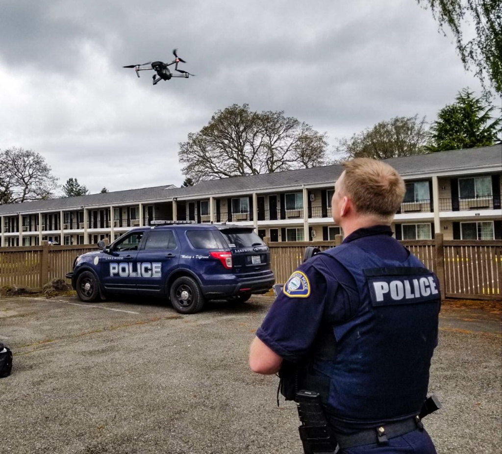 Officer Shawn Noble flies the LPD drone at the Best Western in Lakewood to capture overhead images of Colonial Center Plaza construction