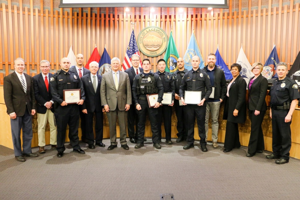 The Lakewood City Council poses with members of the Lakewood Police Department who were recognized for their life-saving efforts in 2019