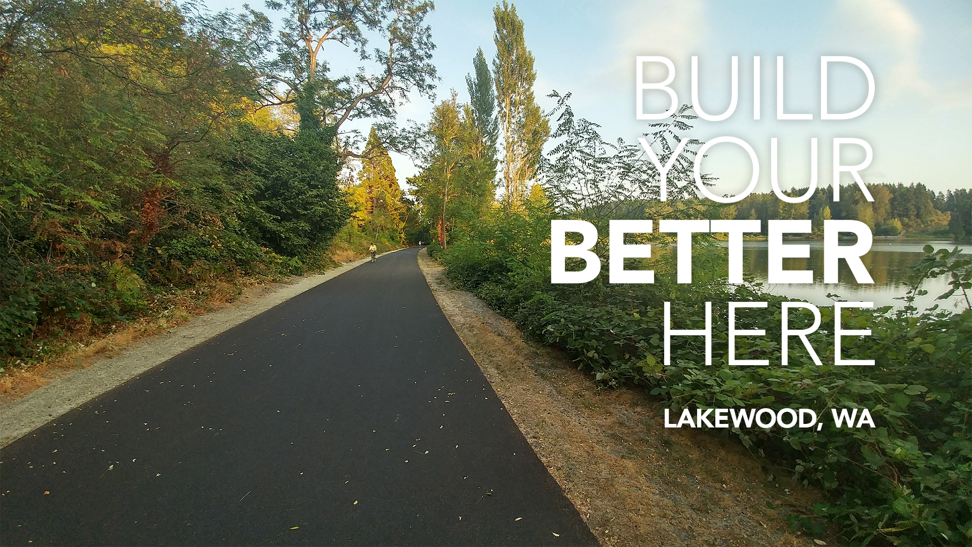 Waughop Lake paved trail through Lakewood, WA with Build Your Better Here Lakewood, WA on right side
