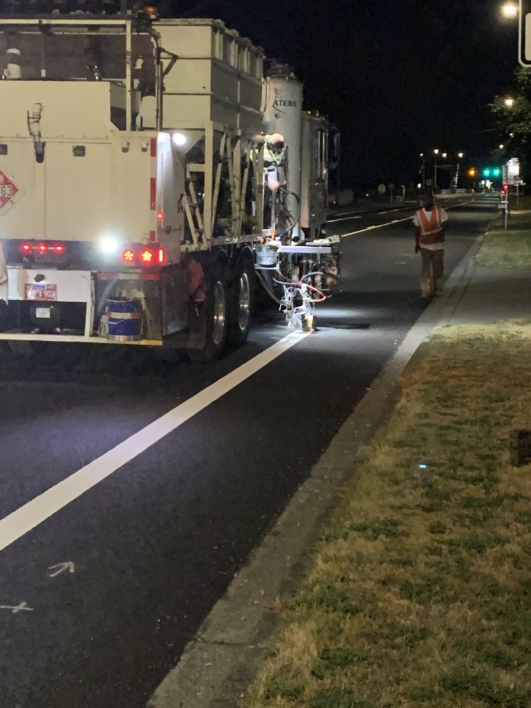 The striping truck placed the bike lane stripe along 108th.