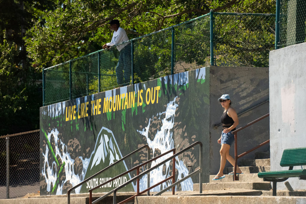 Large mural of Mt. Rainier with the words "Live like the mountain is out."