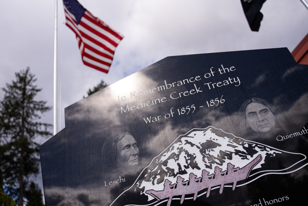 a photo of an engraved piece of stone memorializing the Medicine Creek Treaty