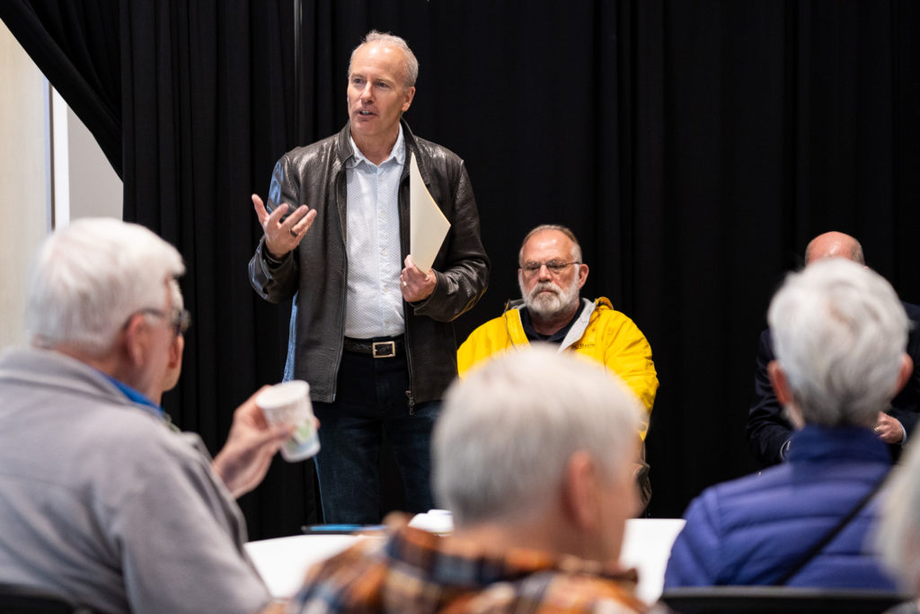 Mayor Jason Whalen addresses a group gathered for his community coffeehouse in 2022