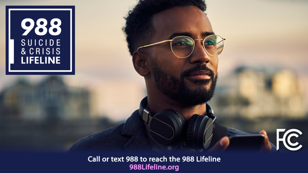 988 suicide and crisis awareness hotline; mane with headphones holding phone