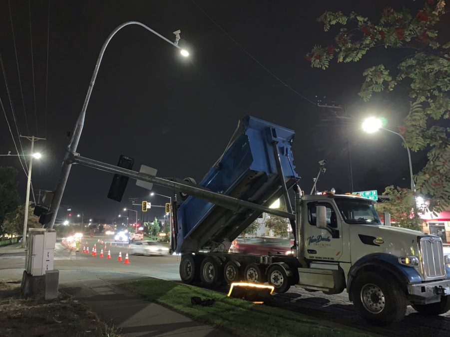 A dump truck struck a traffic signal in Lakewood, breaking the pole
