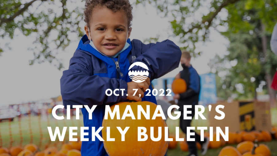 City Manager's Weekly Bulletin Oct. 7, 2022 written over a photo of a young child holding up a pumpkin by its stem