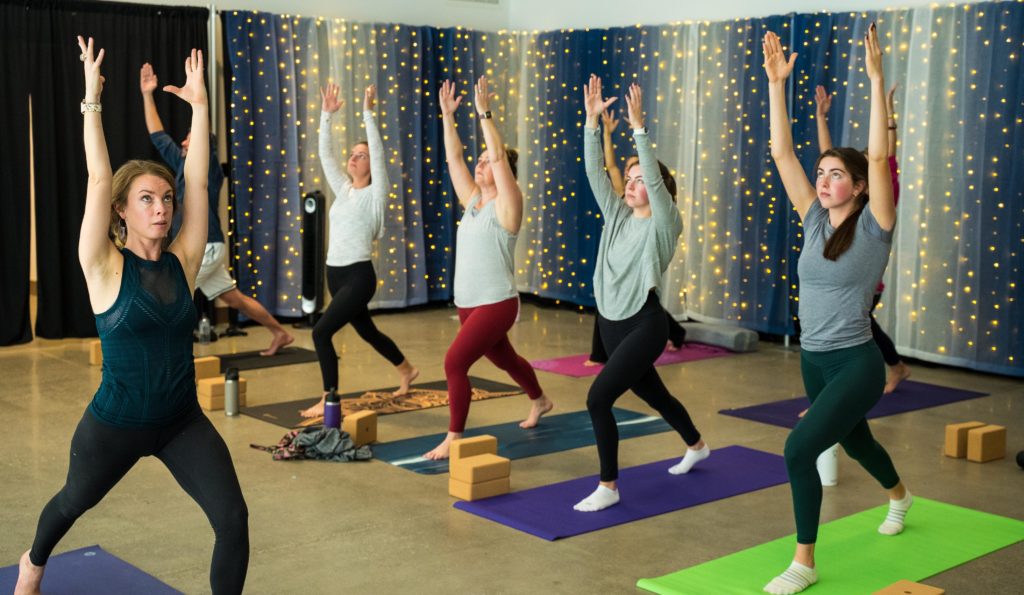 People do yoga inside the Pavilion at Fort Steilacoom Park