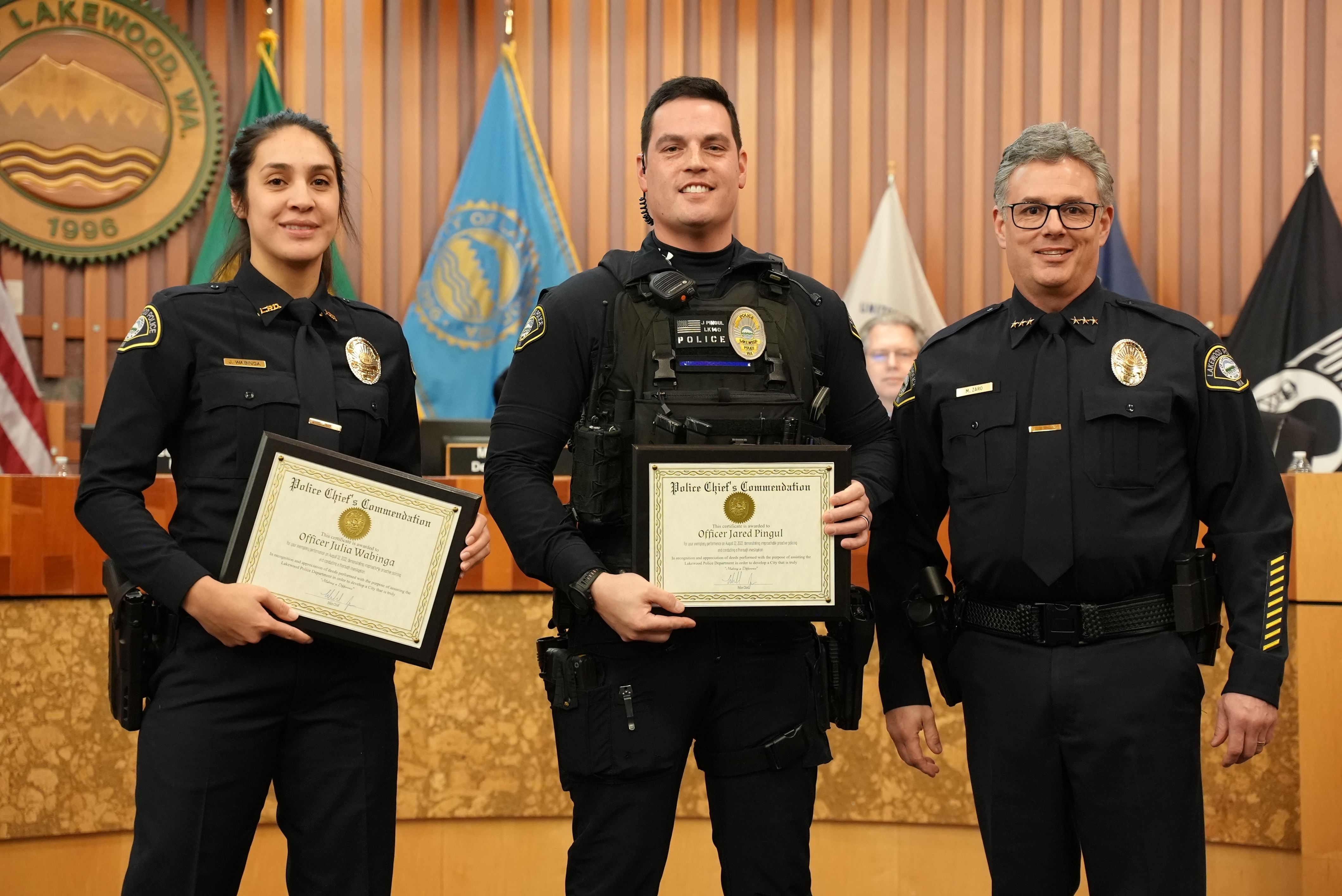 Officers Julia Wabinga and Jared Pingul earn a Police Chief's Commendation award.
