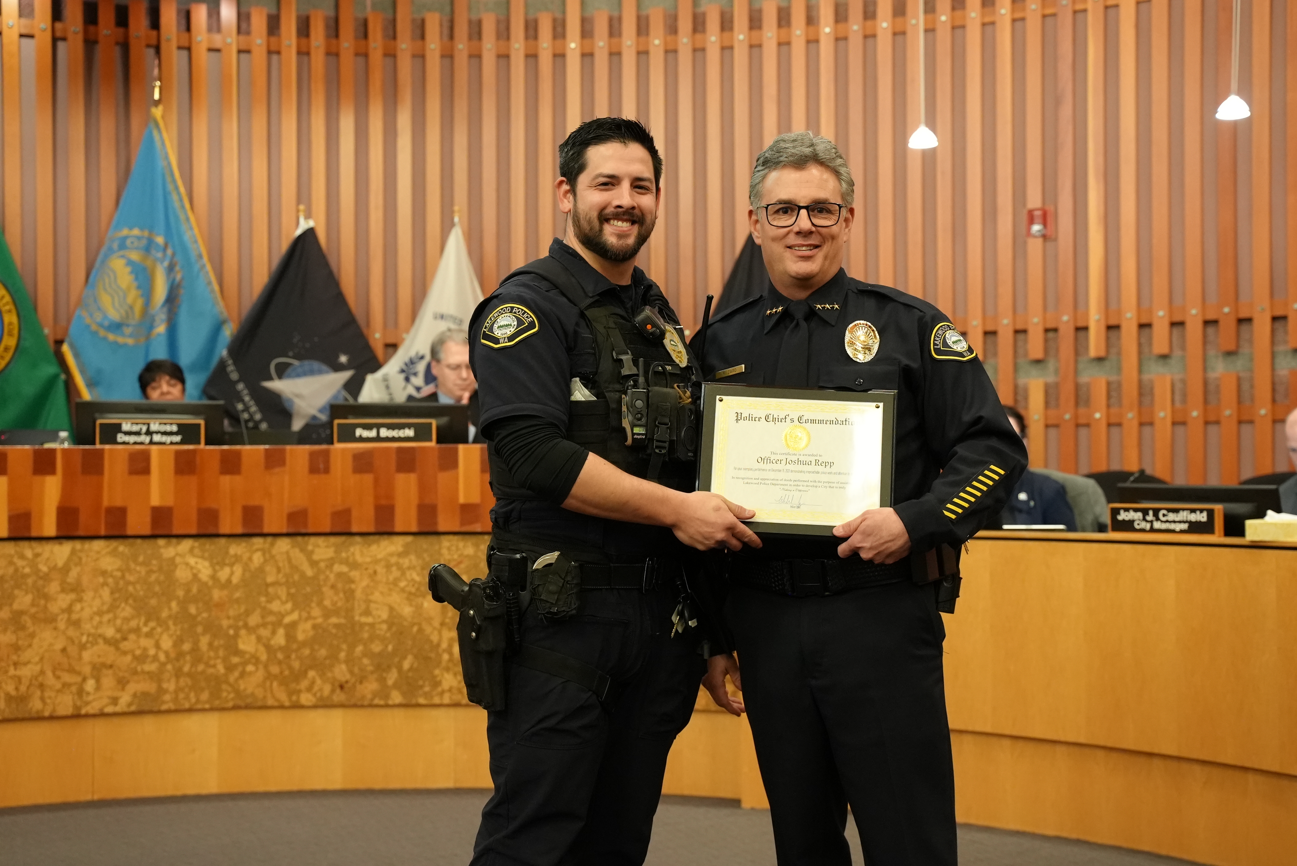 Officer Josh Repp receives a Police Chief Commendation from Chief Zaro.