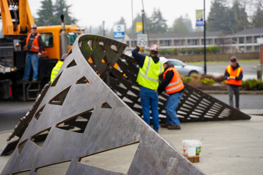 A close up shot of the metal art installation going in at Motor Avenue in Lakewood, WA.