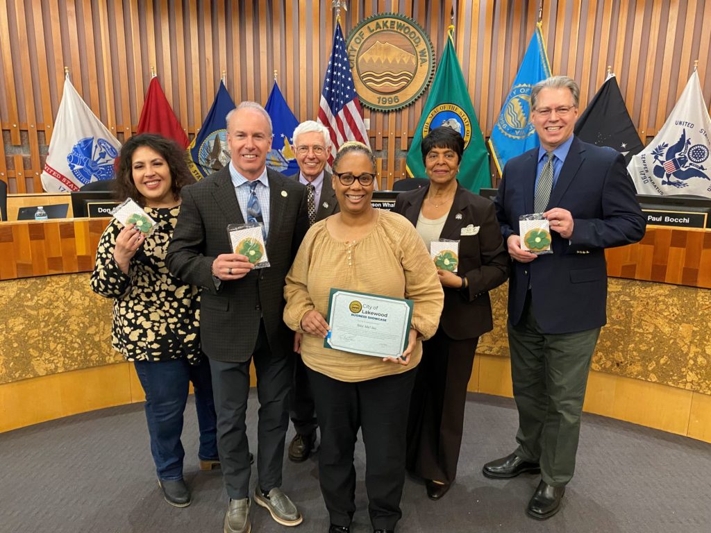 Bite Me! Inc owner Deb Tuggle poses with the Lakewood City Council after being awarded the March 2023 Business Showcase.