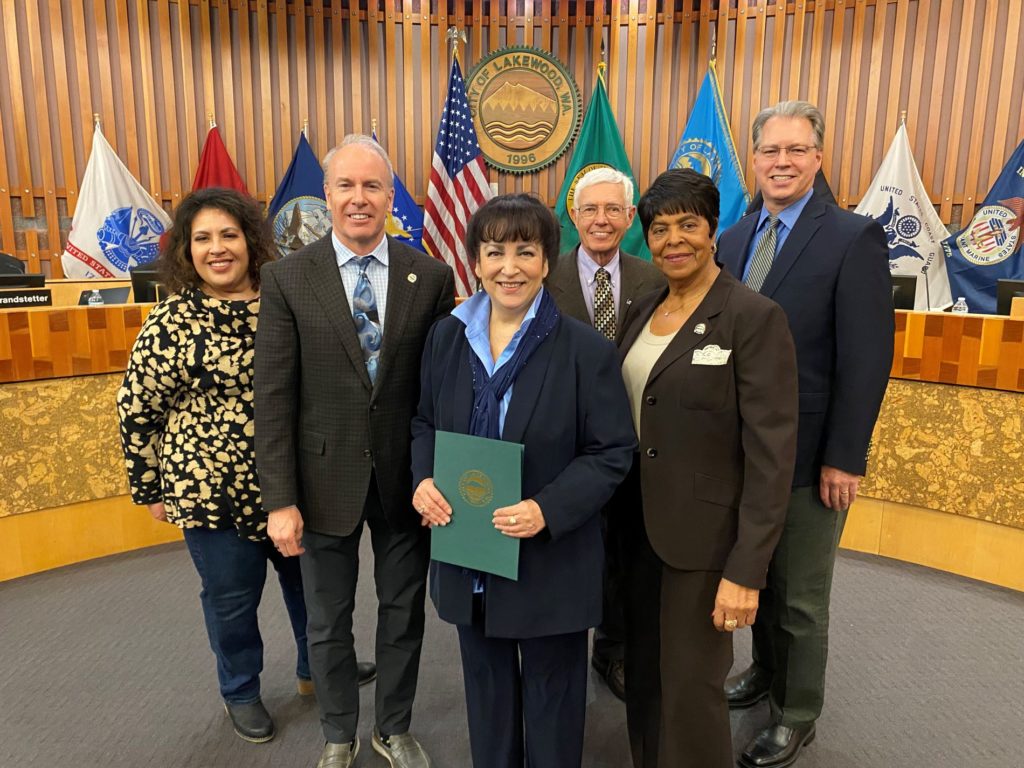 The Lakewood City Council poses with Lakewood Chamber of Commerce Executive Director Linda Smith after reading a Womens History Month proclamation in March 2023.