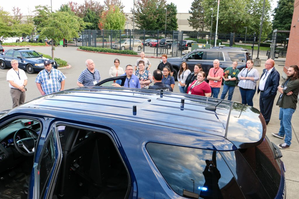 Lakewood residents look at a police cruiser during the 2019 Citizens Academy.