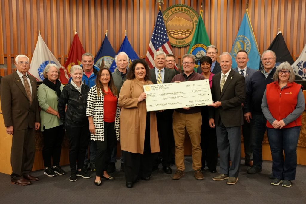 Lakewood City Council members pose with members of the Rotary Club of Lakewood with a check for $11,000 at Council's April 17, 2023 regular meeting