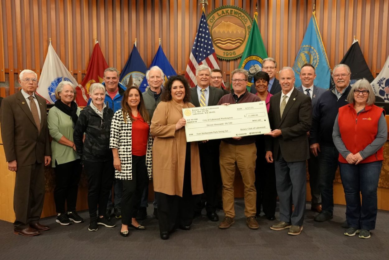 Lakewood City Council members pose with members of the Rotary Club of Lakewood with a check for $11,000 at Council's April 17, 2023 regular meeting