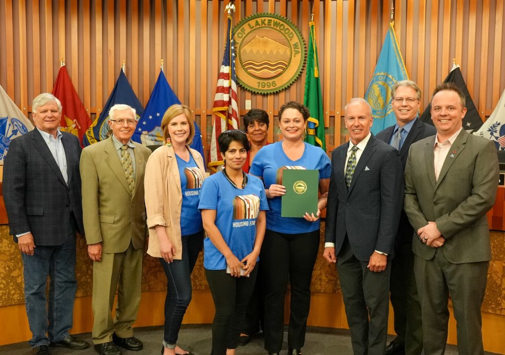 The Lakewood City Council issued a proclamation recognizing the 55th Anniversary of the Fair Housing Act at its May 1, 2023 meeting. Members of the council pose with representatives from the Tacoma-Pierce County Realtors Association.