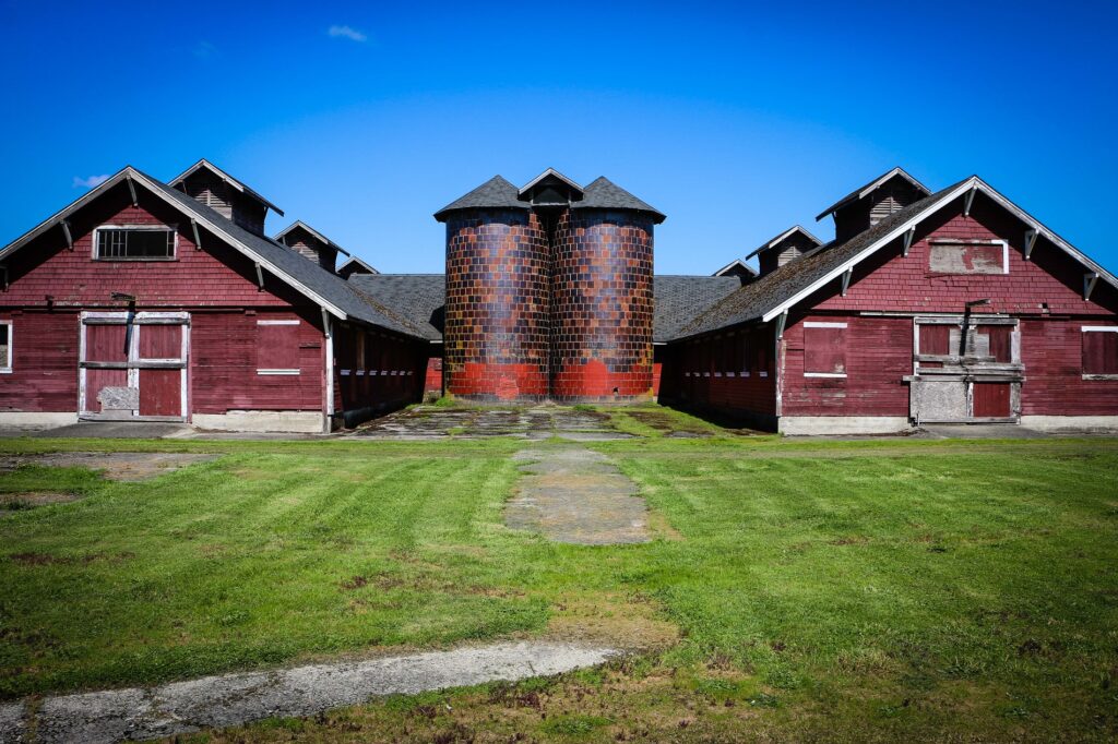 Fort Steilacoom Park H-Barn against a bright blue sky.