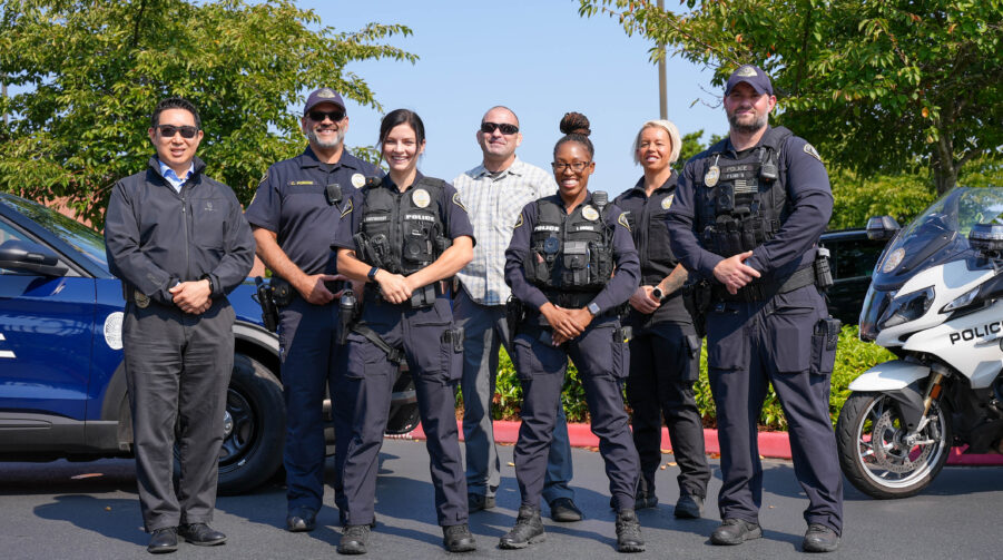 Seven Lakewood Police Officers pose for a photo in front of Lakewood Police Station.