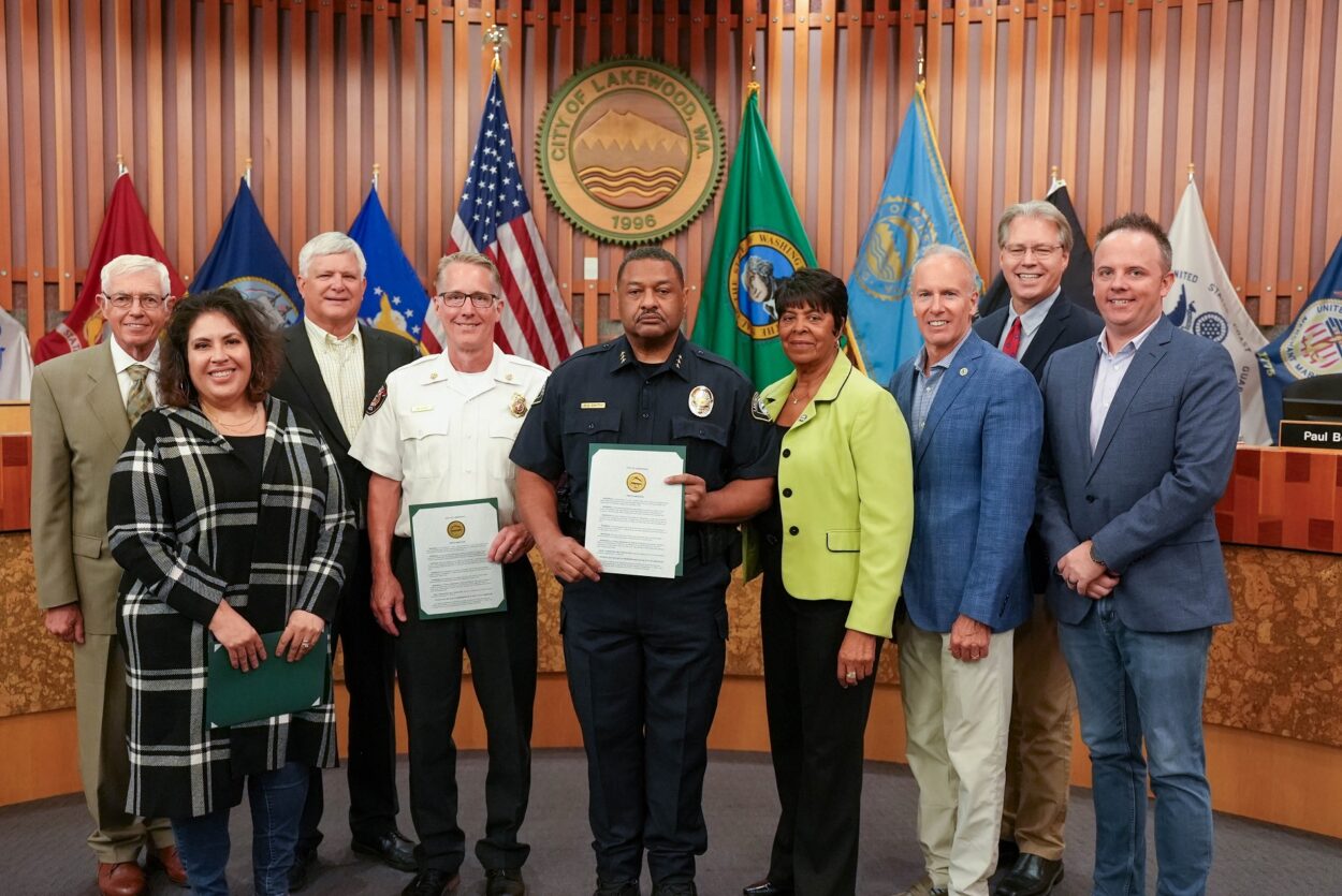 The Lakewood City Council poses with West Pierce Fire & Rescue Chief Jim Sharp and Lakewood Police Chief Patrick D. Smith after issuing a proclamation recognizing Sept. 11, 2023 as a day of remembrance.