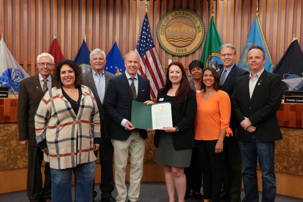 The Lakewood City Council poses with representatives from the Blue Star Families organization at a Sept. 18, 2023 City Council meeting.