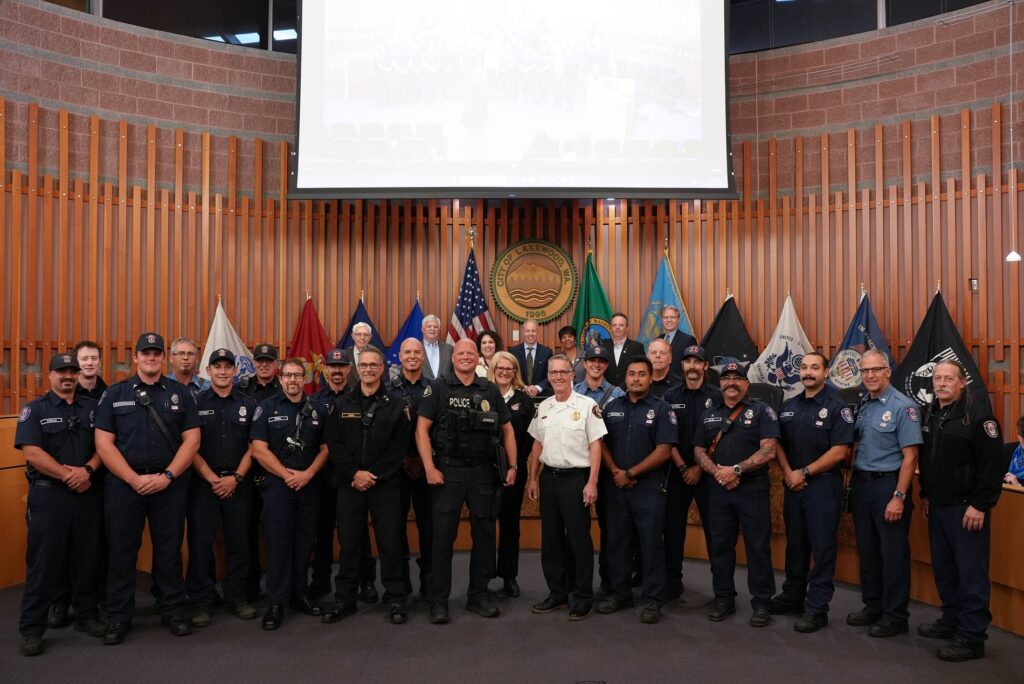 Members of the Lakewood City Council pose with representatives from West Pierce Fire and Rescue and a Lakewood Police Lieutenant at a Sept. 18, 2023 Lakewood Council meeting.