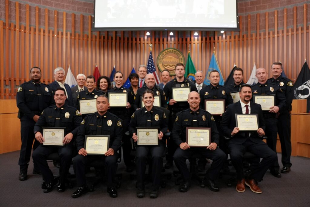 Members of the Lakewood Police Department pose with the Lakewood City Council