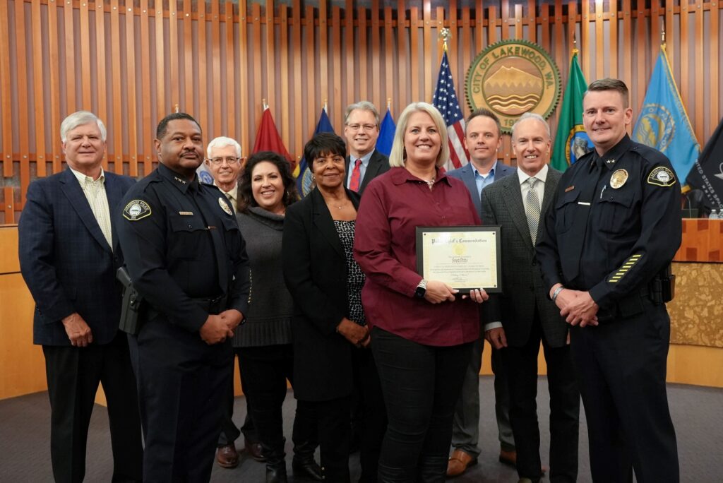 Lakewood Police Administrative Technician Svea Pitts poses with the Lakewood City Council