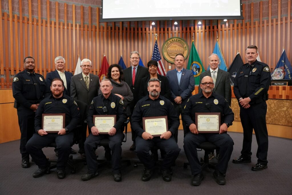 Members of the Lakewood Traffic Unit pose with the Lakewood City Council