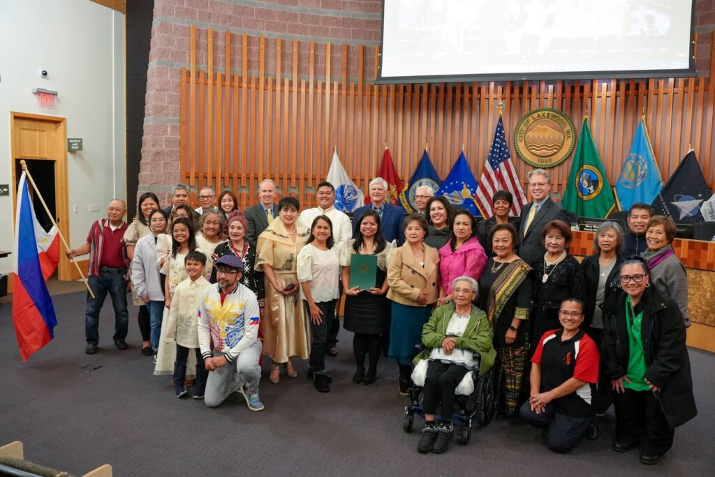 The Lakewood City Council poses with representatives from the Filipino American community after issuing a proclamation recognizing October as Filipino American History Month.