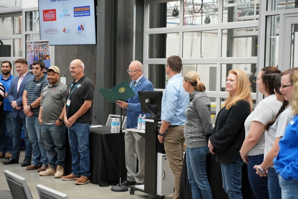 Mayor Jason Whalen reads a proclamation at the first-ever Manufacturing Day Expo held in Lakewood on Oct. 5, 2023.