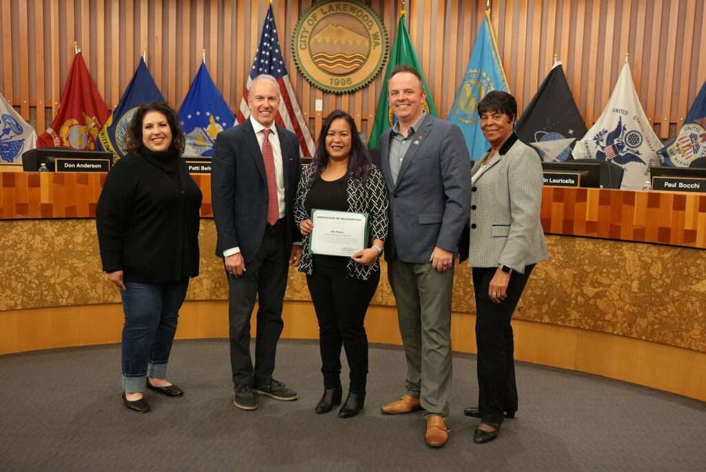 AA Meats owner Tammy Faelnar poses with the Lakewood City Council after receiving the November 2023 Business Showcase