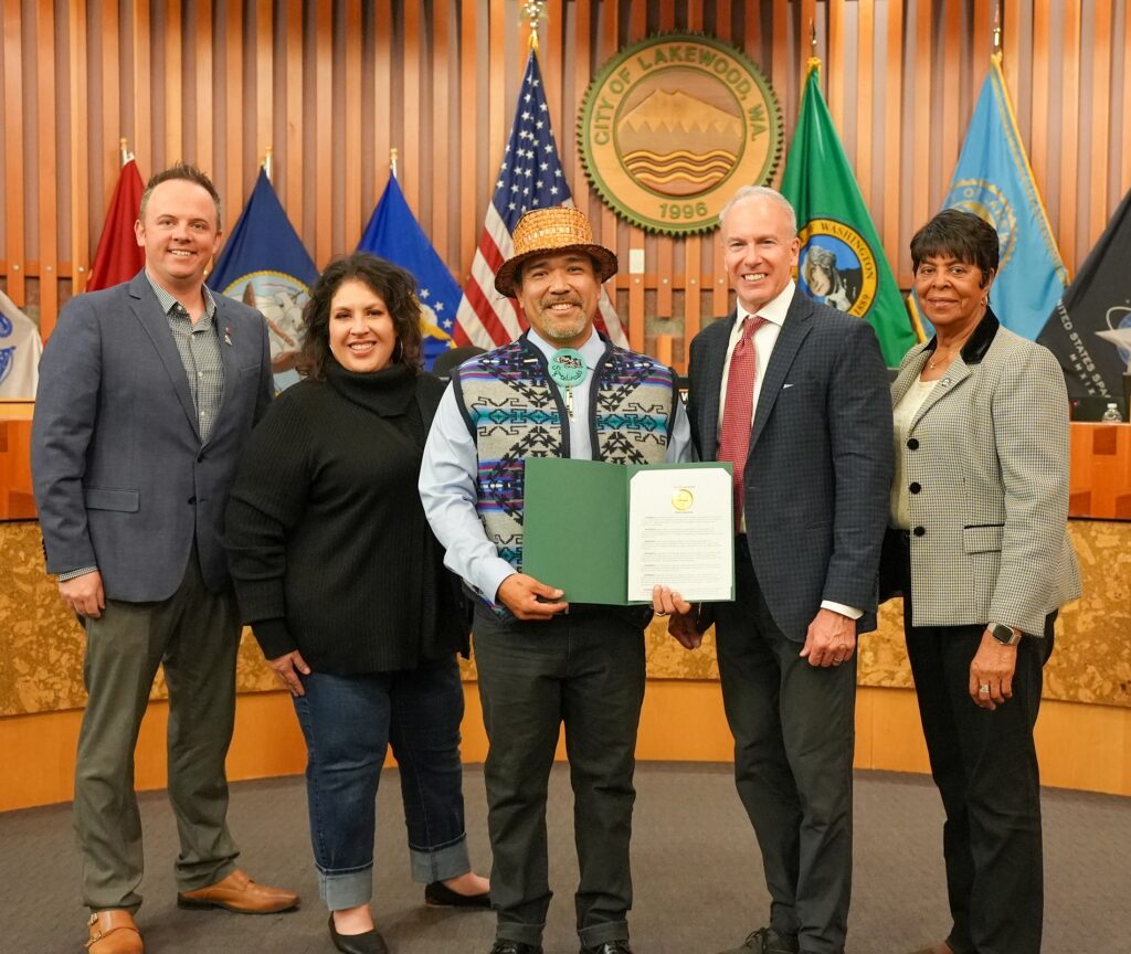 Members of the Lakewood City Council issue a proclamation recognizing November as Native American Heritage Month to Hweqwidi Hanford McCloud with the Nisqually Tribe.