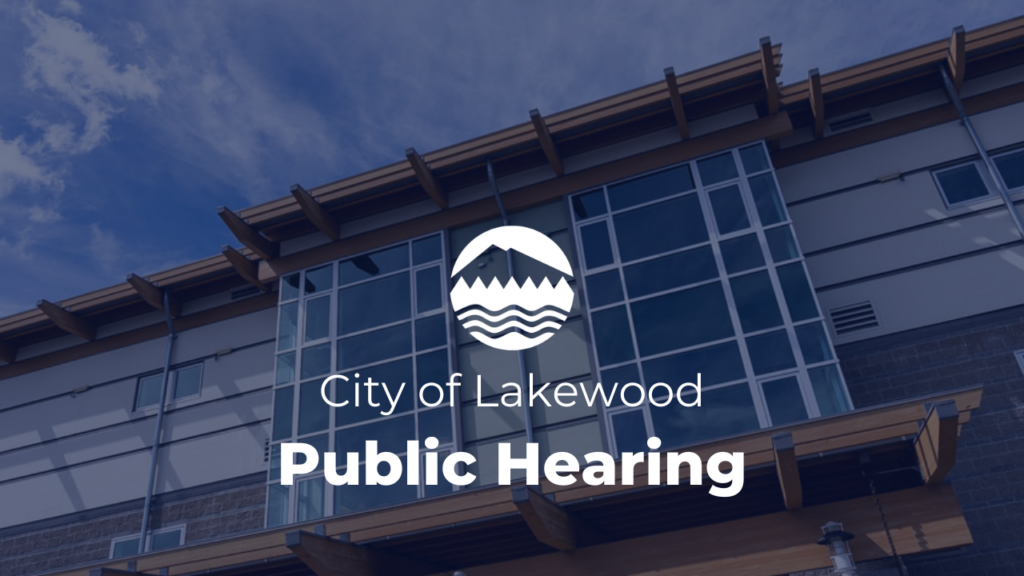 White text reads City of Lakewood Public Hearing. Above the text is the City of Lakewood emblem in white. The background is a photo of Lakewood City Hall.