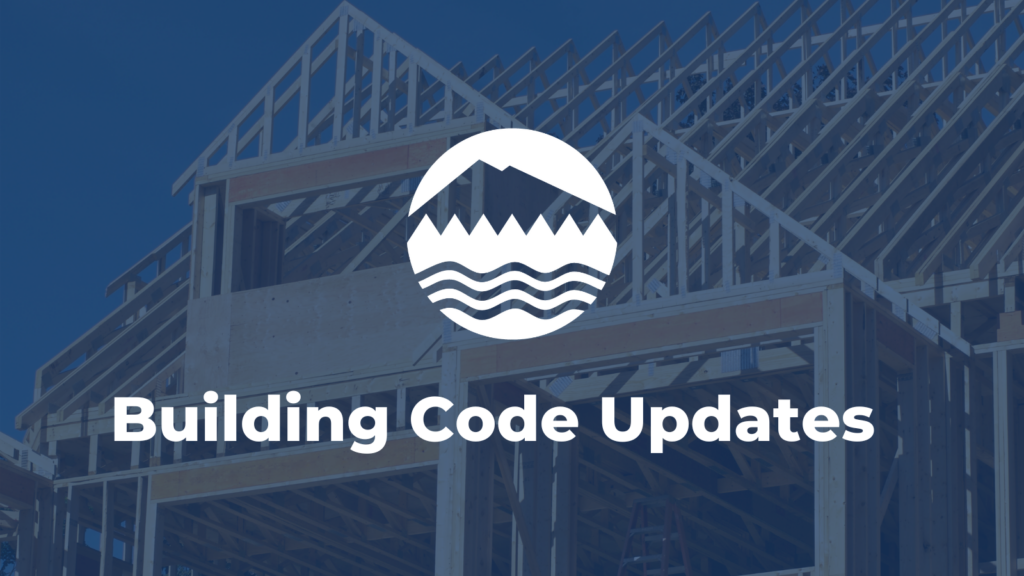 White text reads Building Code Updates over an image of a frame of a house