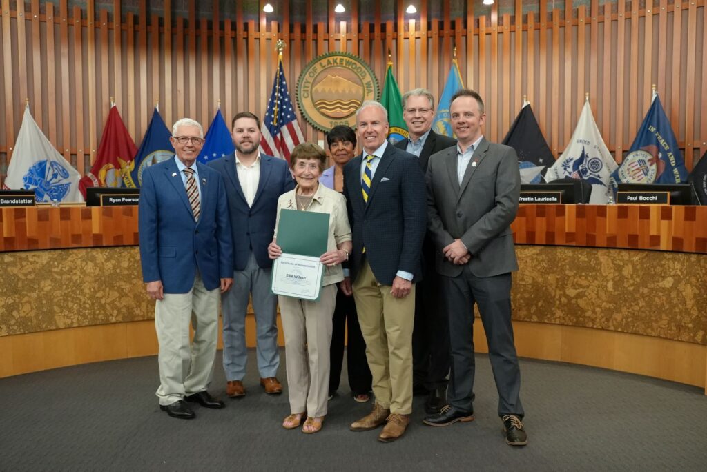 Longtime Lakewood volunteer Ellie Wilson poses with members of the Lakewood City Council after they recognized her with a certificate for her volunteerism and 12 years of service on the Lakewood Promise Advisory Board.