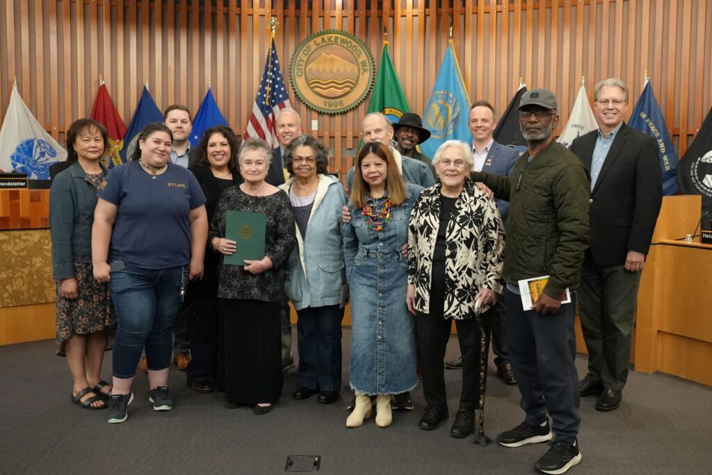 Members of St. Joseph-St. John Episcopal Church pose with the Lakewood City Council to receive the 2024 Juneteenth Proclamation