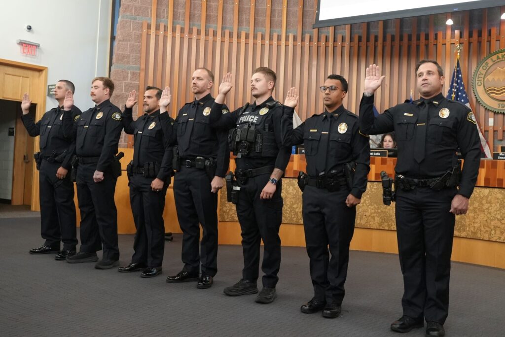 Members of the Lakewood Police Department are sworn in during the Aug. 19, 2024 Lakewood City Council meeting.