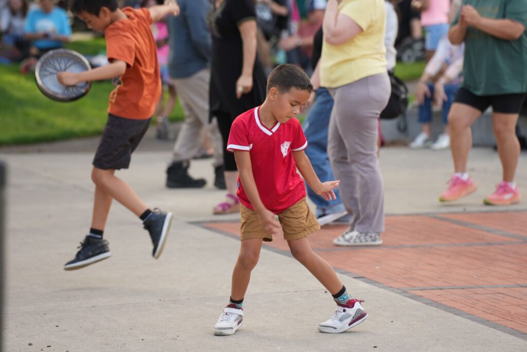 A child dances at a Lakewood Summer Nights at the Pavilion summer concert in 2024