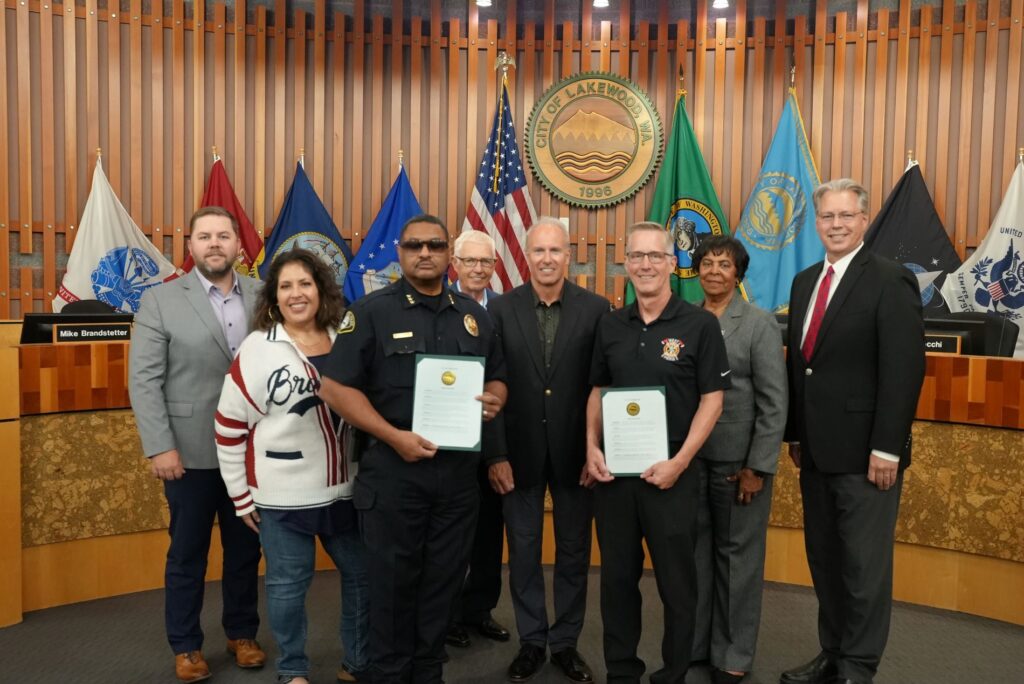 Members of the Lakewood City Council pose with Lakewood Police Chief Patrick D. Smith and West Pierce Fire & Rescue Chief Jim Sharp after issuing a proclamation recognizing Sept. 11, 2024 as a day of remembrance.