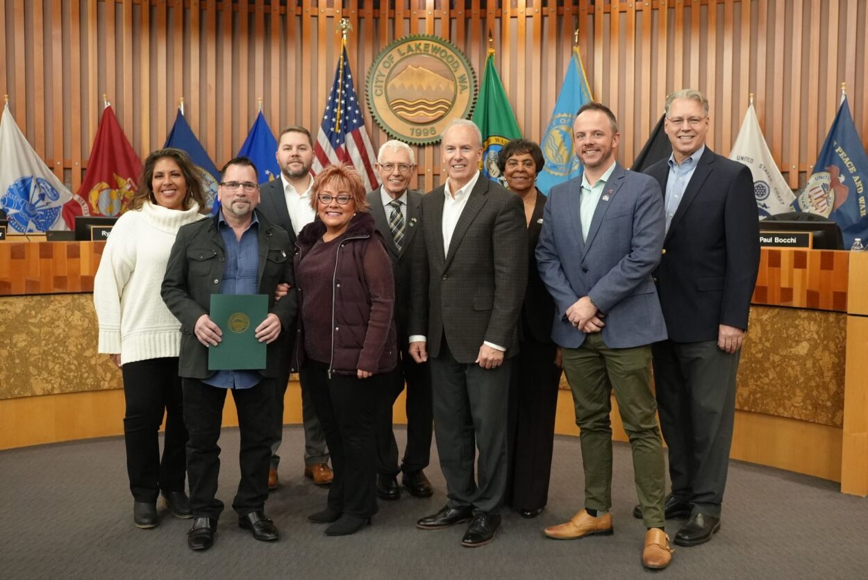 The Lakewood City Council poses with Diamond Designs Unlimited owner Shawn Luvaas after presenting him with the November Business Showcase award