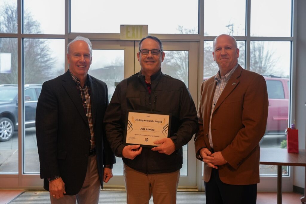 Capt. Jeff Alwine poses with Lakewood Mayor Jason Whalen and City Manager John Caulfield after receiving a Guiding Principle Award in 2024.