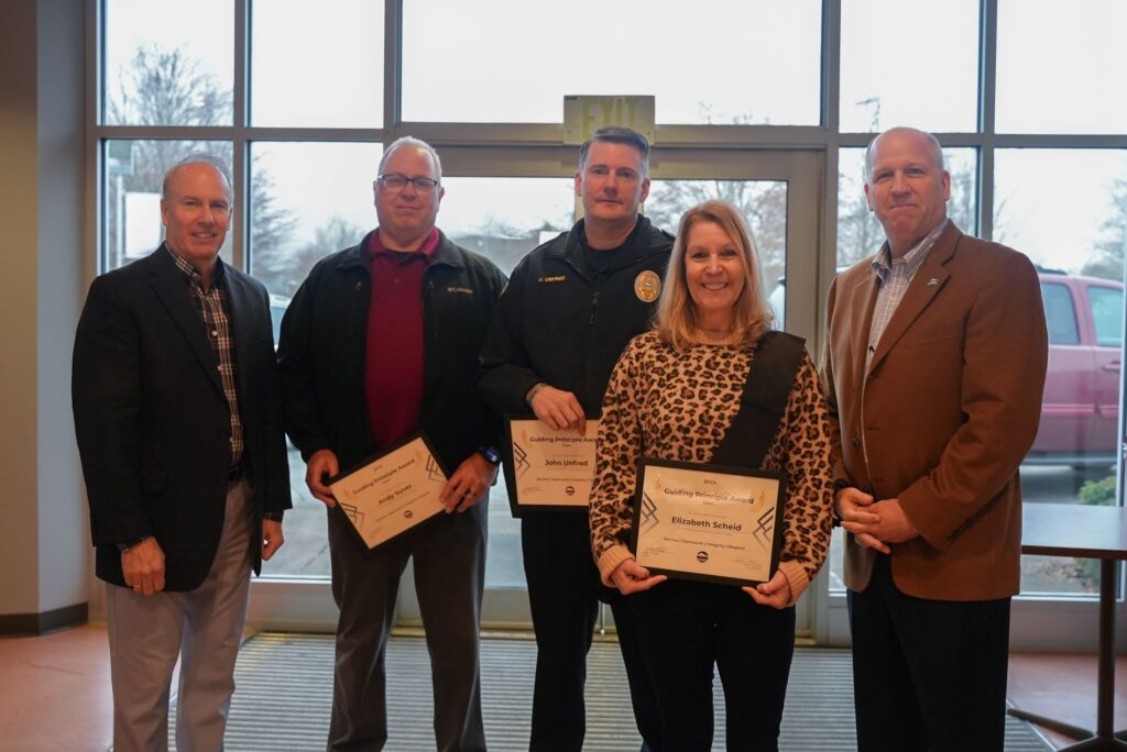 Lakewood Mayor Jason Whalen and City Manager John Caulfield stand with Sgt. Andy Suver, Assistant Chief John Unfred and recreation coordinator Elizabeth Scheid who received the 2025 Guiding Principal Award for their deployment to North Carolina to help with Hurricane Helene relief efforts.