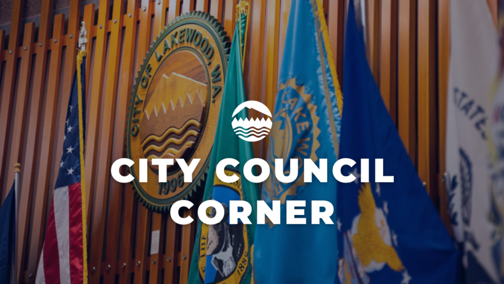 A photo of the Lakewood City Council Chambers with a close up shot of the City Seal and flags around it. White text reads City Council Corner.