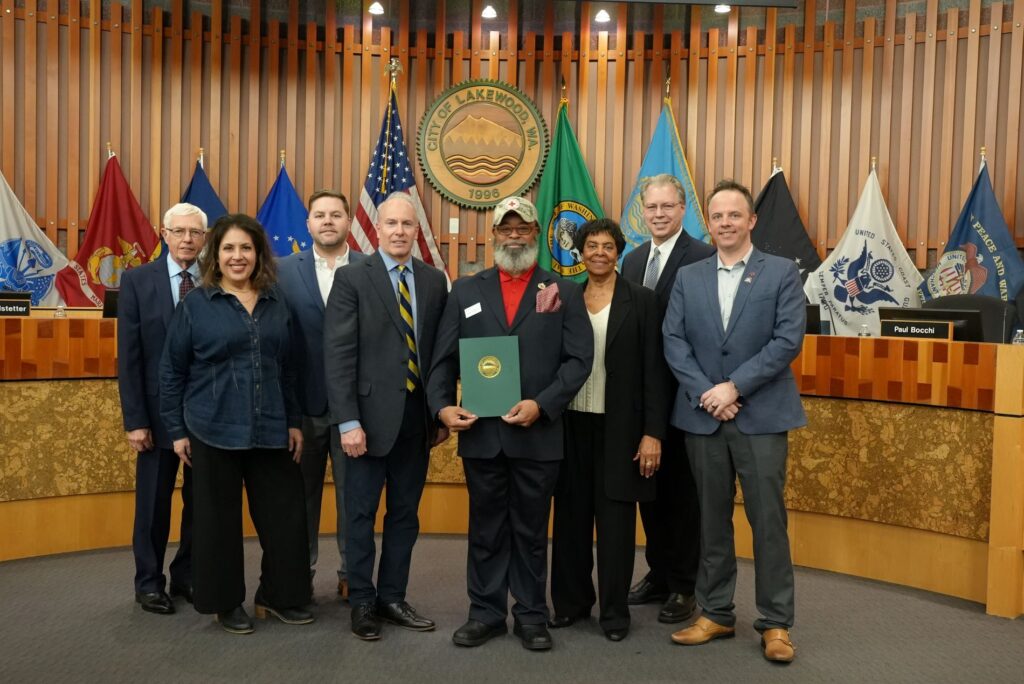 Members of the Lakewood City Council pose with a representative from The Red Cross who accepted a proclamation from the Council for Red Cross Month.