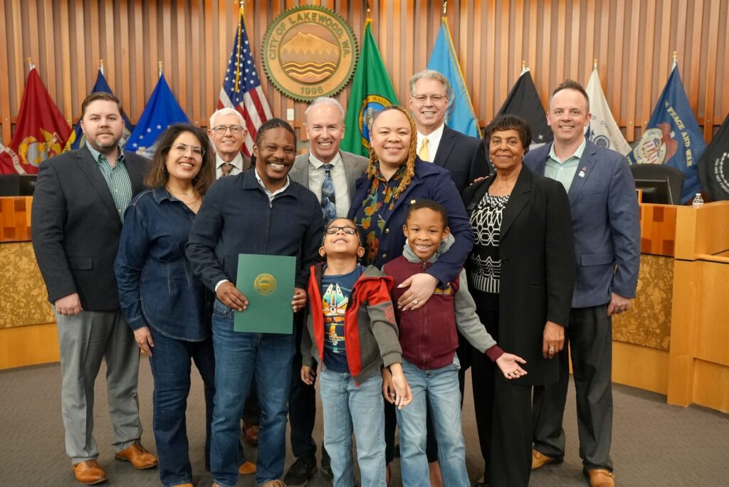 The Lakewood City Council poses for a photo in Council Chambers with the Blocker family to recognize April 11-17, 2025 as Black Wellness Week.